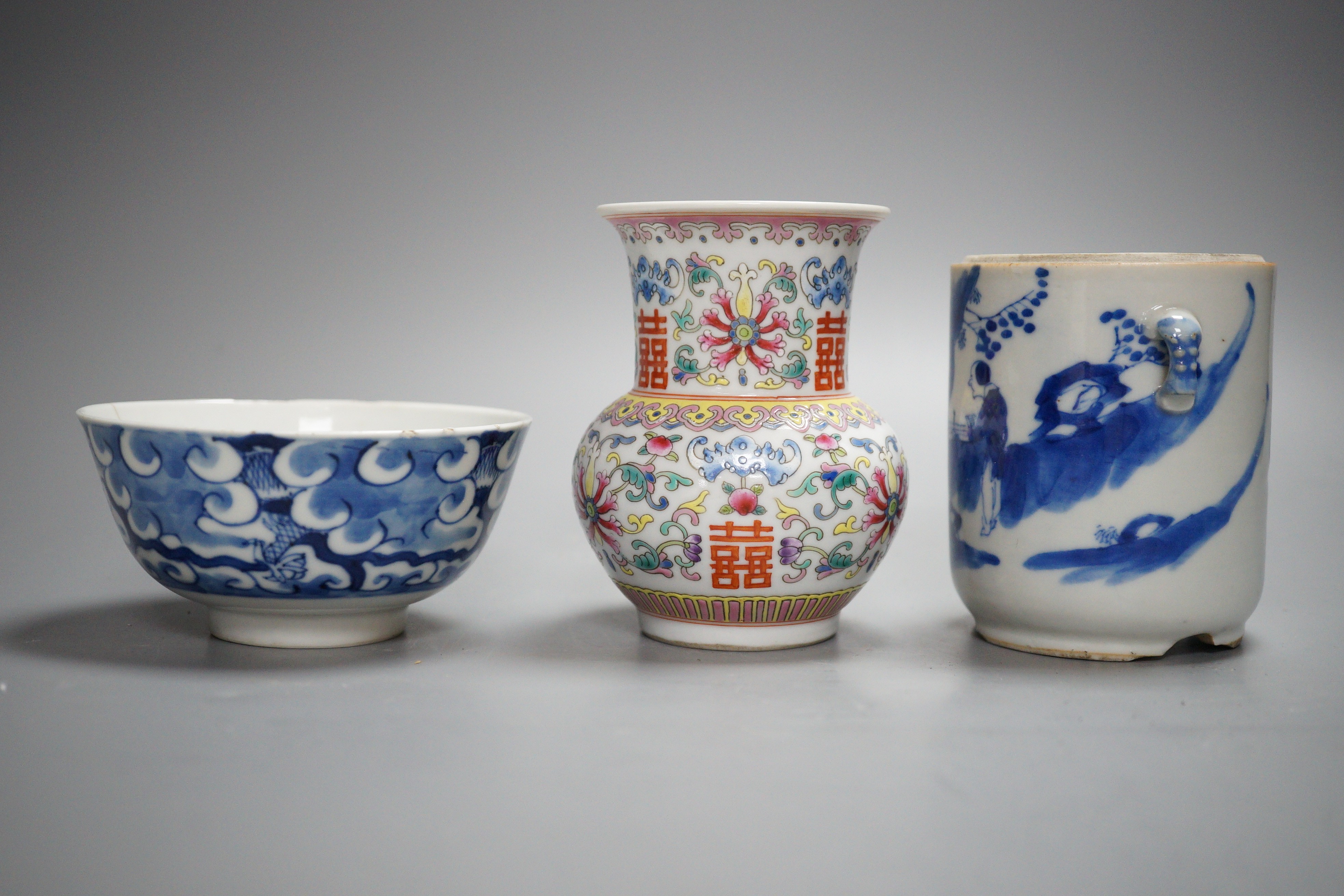 An early 20th century Chinese famille rose vase, a Chinese blue and white jar, lacking cover and a blue and white bowl